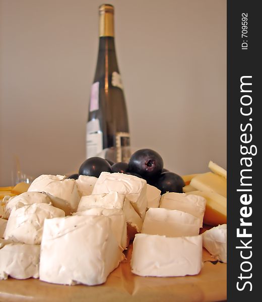 Plate with all kind of cheeses and bottle of wine. Plate with all kind of cheeses and bottle of wine
