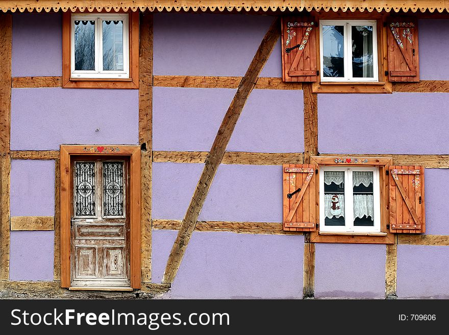 In the street of a alsacian villlage in the summer: half timbered traditional house. In the street of a alsacian villlage in the summer: half timbered traditional house