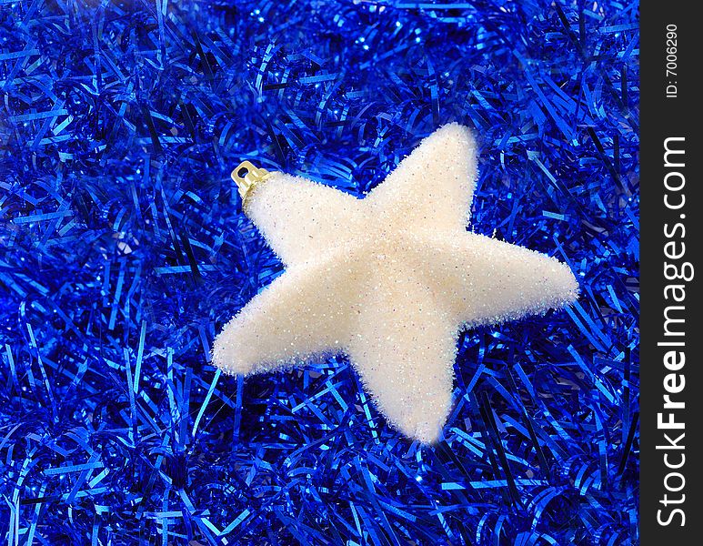 Christmas star decorations on tinsel. Christmas star decorations on tinsel