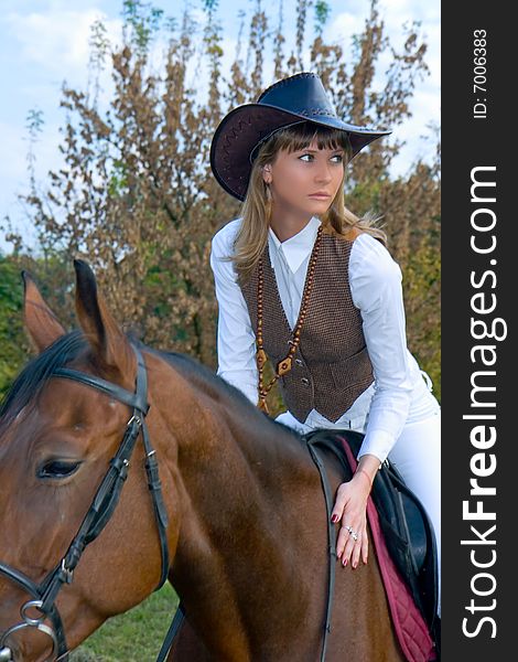 Pretty Young Woman Riding  Horse.