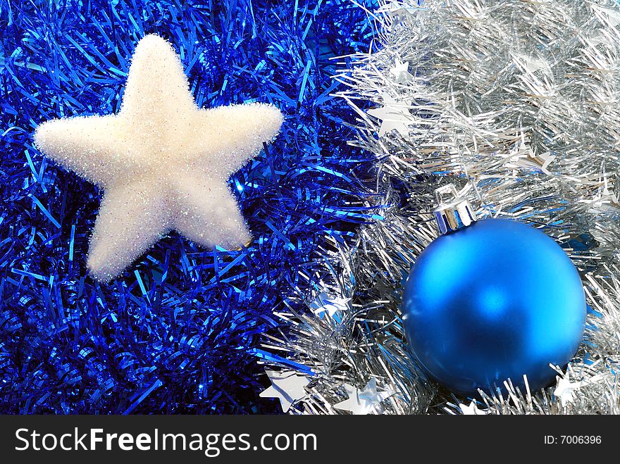 Christmas ball and star decorations on tinsel. Christmas ball and star decorations on tinsel