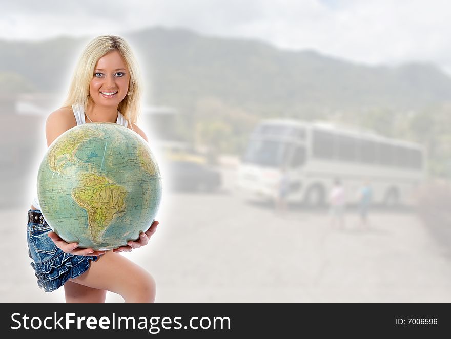 Beautiful blonde with  globe on background