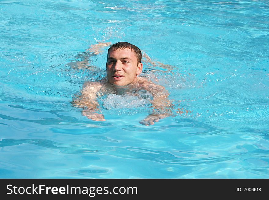 The guy floats in pool. The guy floats in pool