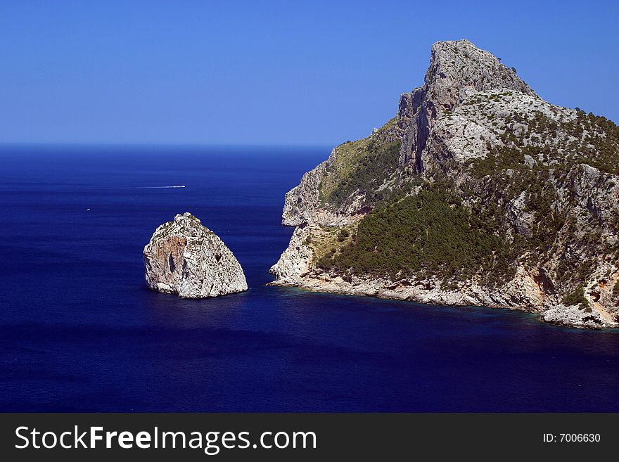 Mountain with a rock in a sea in Majorca in Spain. Mountain with a rock in a sea in Majorca in Spain