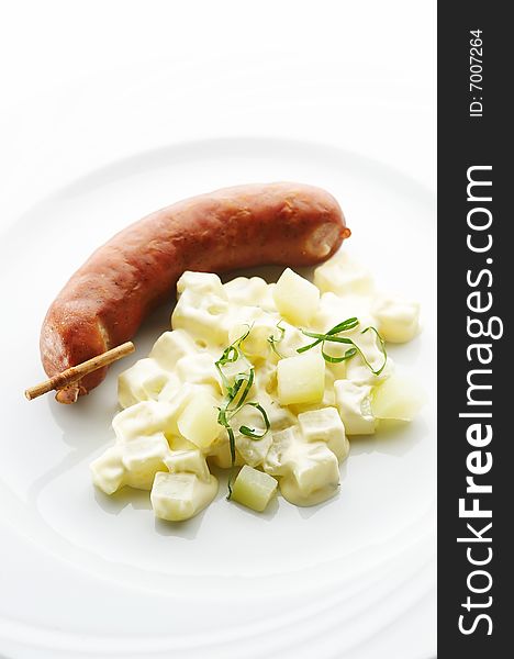 Kransky sausage with boiled potato and leek