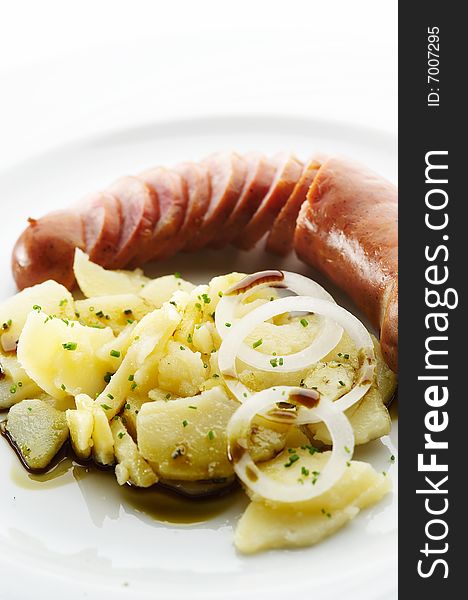 Kransky sausage with boiled potato, onion and pumpkin oil 1