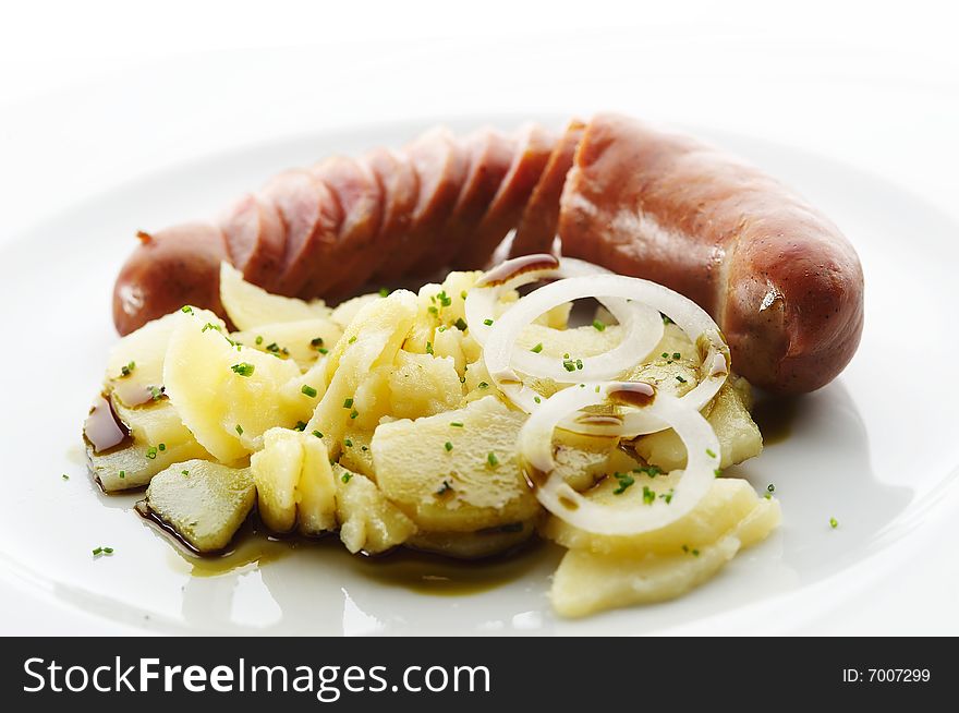 Kransky sausage with boiled potato, onion and pumpkin oil 1