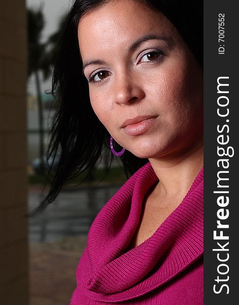 Young latina female looking at the camera