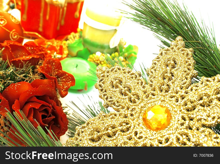 Christmas ornaments,yellow snow flake,candles,rose,fir-tree.