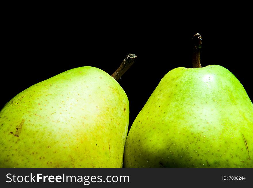 Pair of pears isolated on black background. Pair of pears isolated on black background