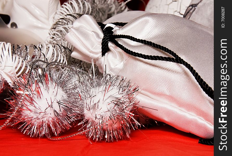 Xmas decoration with gift bag on a red cloth