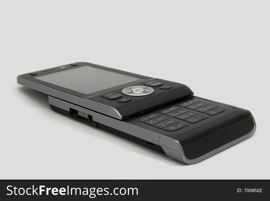 Small modern mobile phone isolated on background