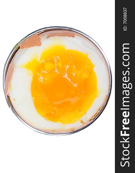 Brown egg in an eggcup on white background