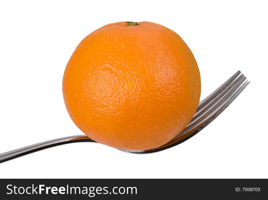 Tangerine on a fork over white background