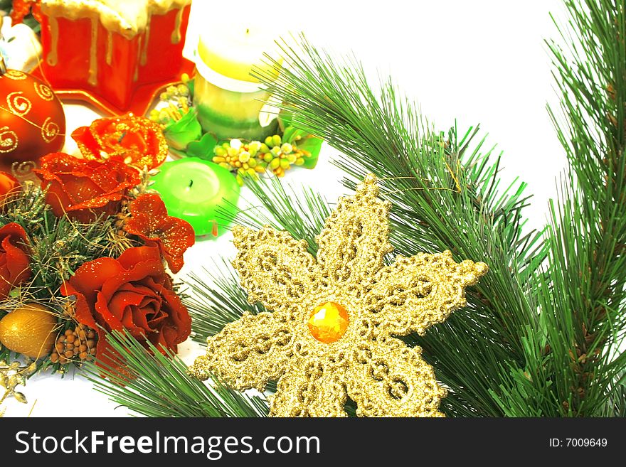 Christmas ornaments,yellow snow flake,fir-tree,candles,rose.