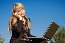 Woman With Laptop Talking On A Phone Stock Photos