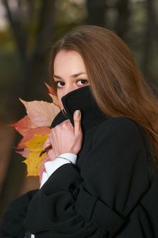 Young Girl Hides Behind Stand-up Collar. Stock Photography