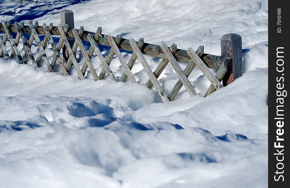 Wooden Fence On Snow