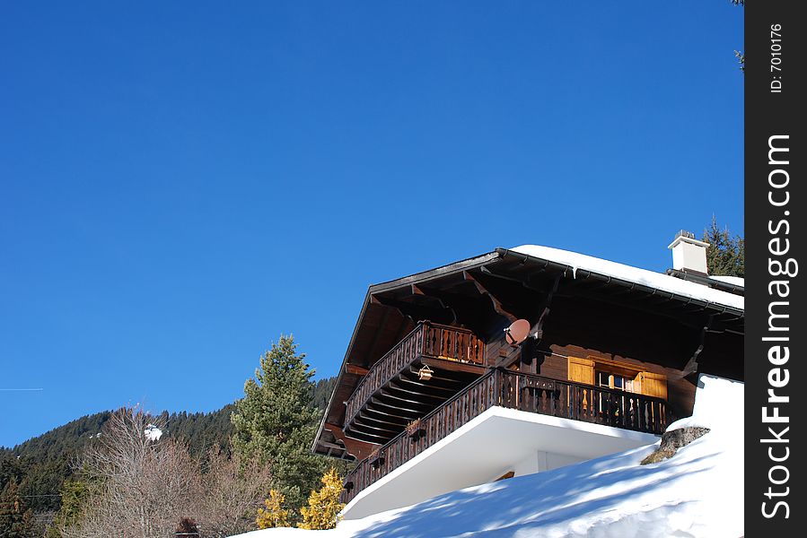 Swiss Wooden Cabin In Winter