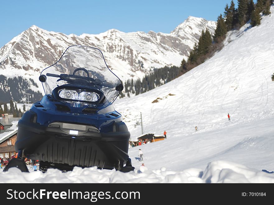 The snow mobile in the swiss Alps. The snow mobile in the swiss Alps