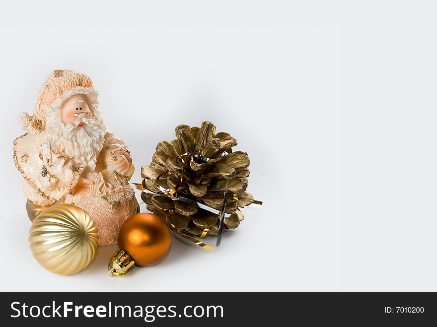 Santa Claus with a bag of gifts and balls isolated on white