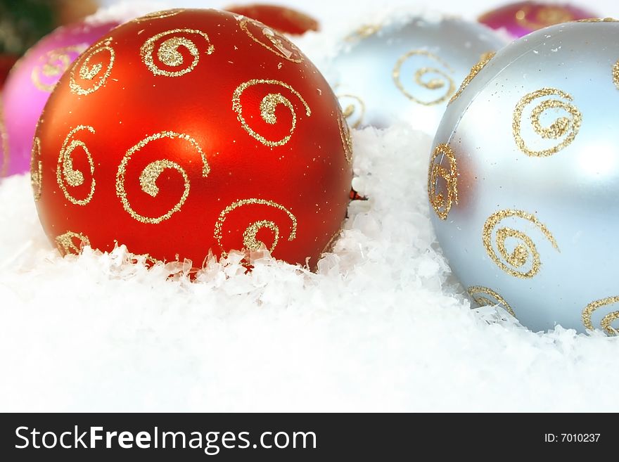 Christmas colorful balls in the snow.