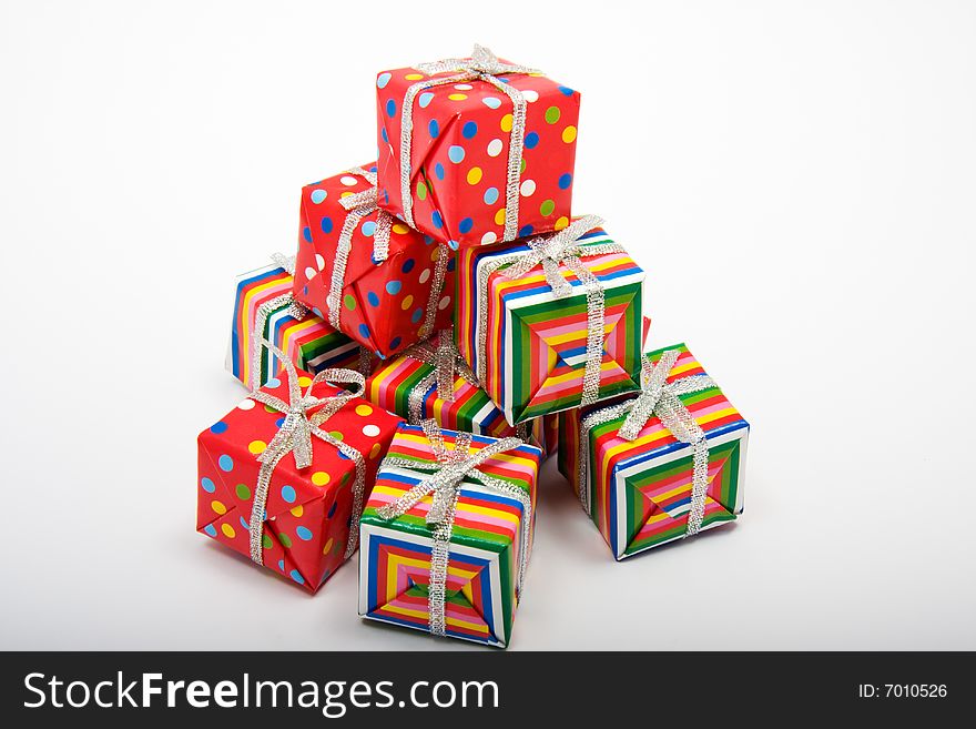 A collection of brightly wrapped christmas gifts