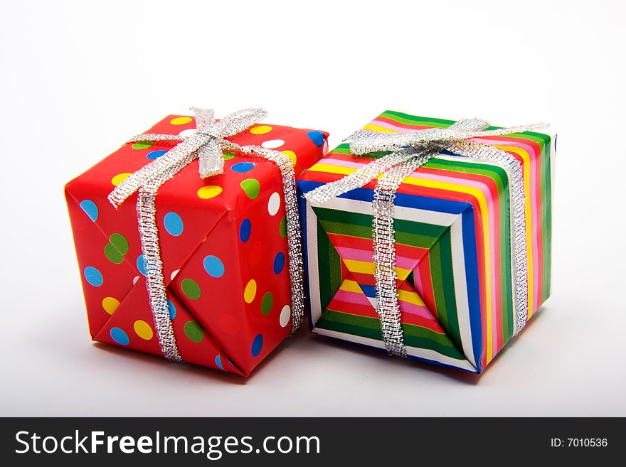 Two brightly wrapped presents for a birthday or Christmas. Two brightly wrapped presents for a birthday or Christmas