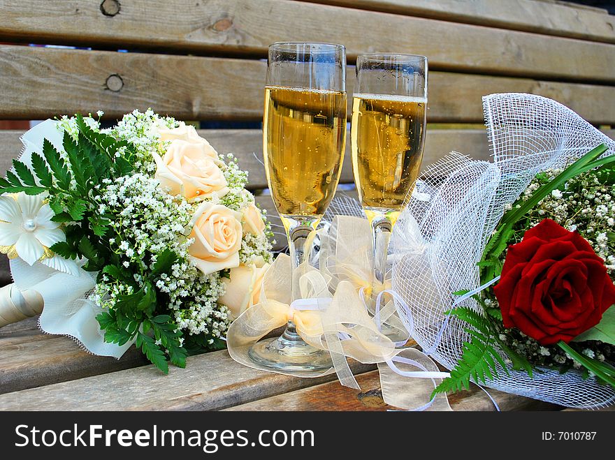 Wedding bouquets and glasses of champagne.