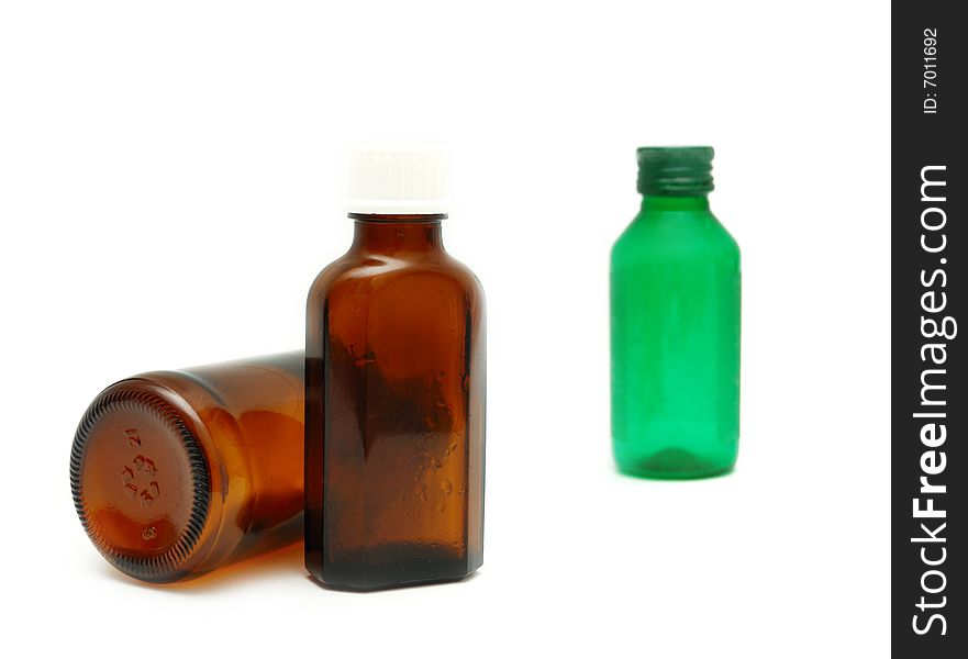 Medicine bottles of brown and green colors