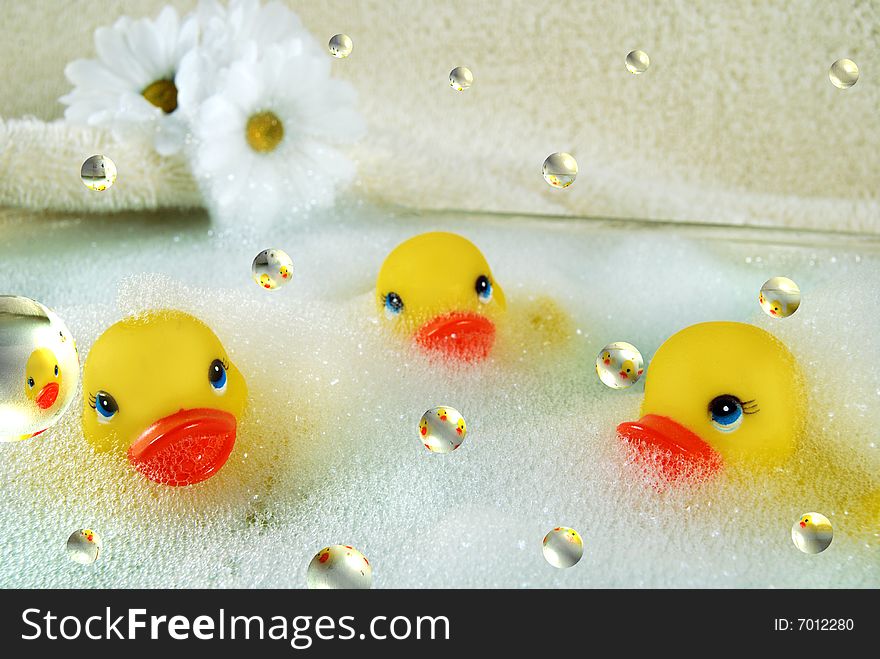 Floating bubbles with rubber ducks and daisies. Floating bubbles with rubber ducks and daisies.