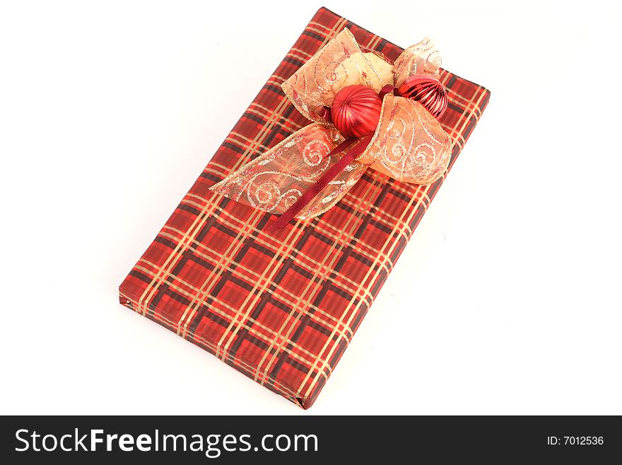 Christmas present in red paper with unusual decorations