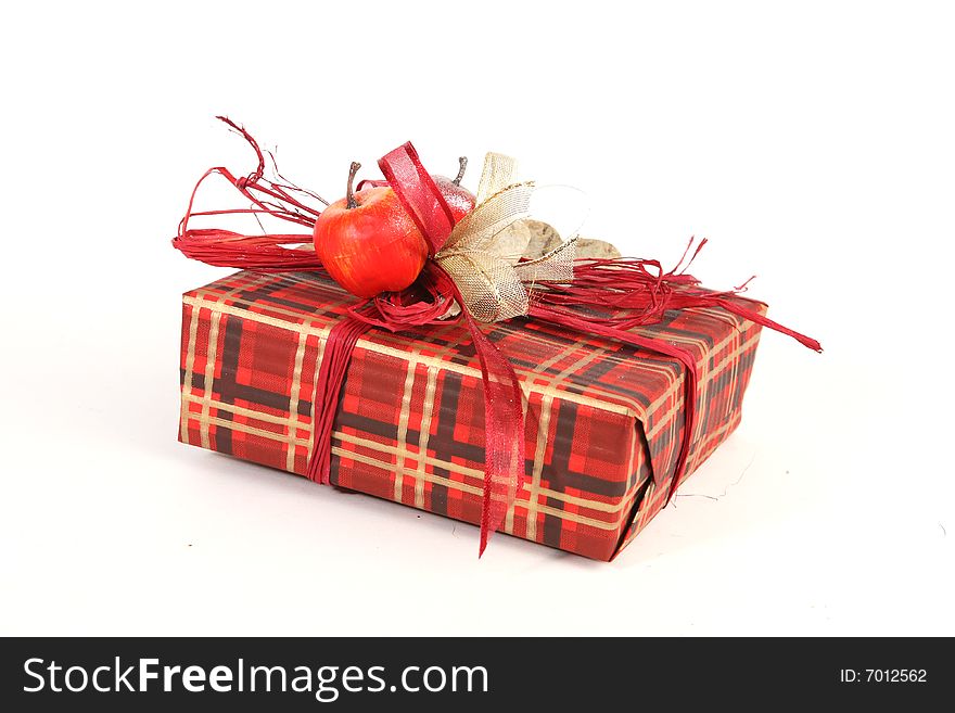 Christmas present in red paper with unusual decorations