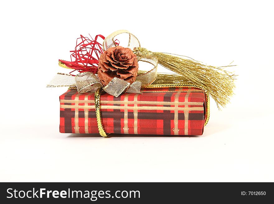 Christmas present in red paper with unusual decorations