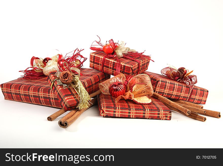 Five christmas presents in red paper with unusual decorations
