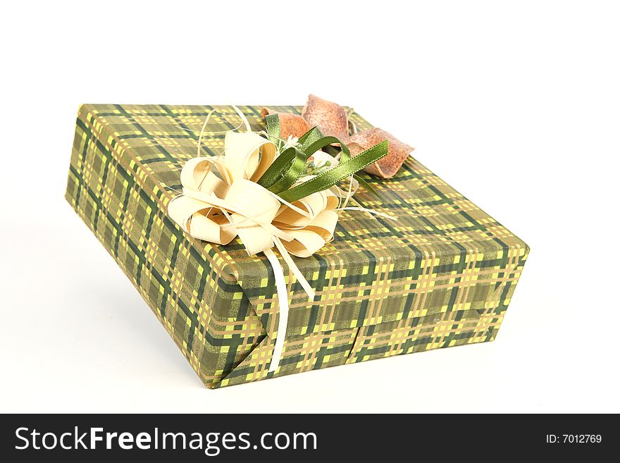 Christmas present in green paper with unusual decorations