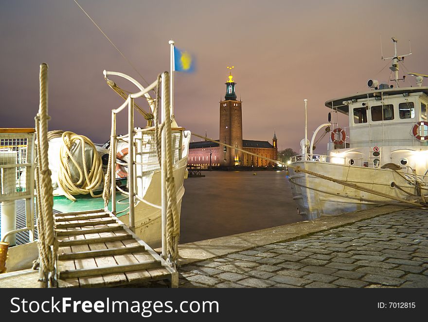 Stockholm City Hall as seen from Riddarholmen. Cloudy sky, windy and no snow, temperature +2 Celsius. Stockholm City Hall spreads some light and makes the terrible Swedish winter night a little bit easier to endure.

This is where the annual Nobel Prize banquet is held on December 10.