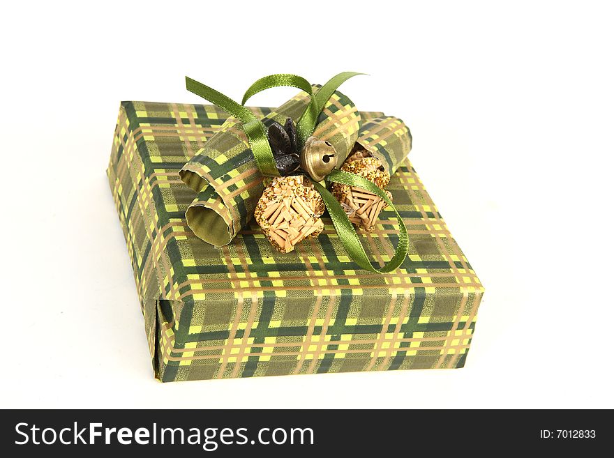 Christmas present in green paper with unusual decorations