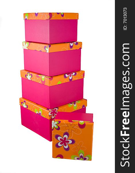 A huge stack of pink with orange flowered top presents. A huge stack of pink with orange flowered top presents.