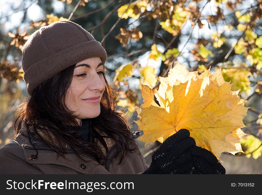Woman with yellow leaves in autumn forest. Woman with yellow leaves in autumn forest