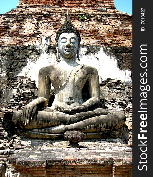 A stone Buddha in Sukhothai, Thailand. A stone Buddha in Sukhothai, Thailand