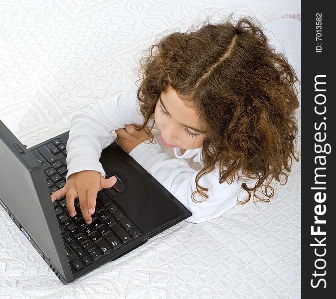 Young girl and laptop computer