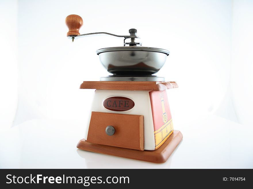 Vintage coffee grinder on white background