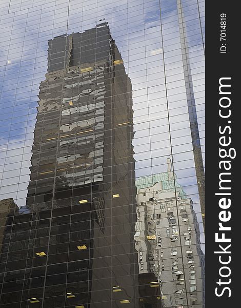Two buildings reflected on an other at NYC. Two buildings reflected on an other at NYC