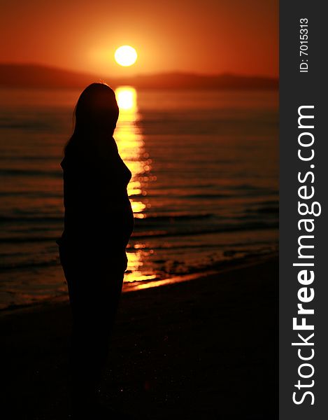 Beautiful portrait of pregnant lady at sunset. Beautiful portrait of pregnant lady at sunset
