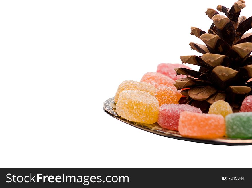 Color candies on plate isolated on white