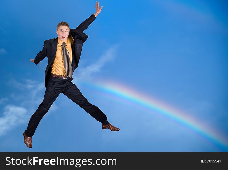 An image of rainbow and jumping man
