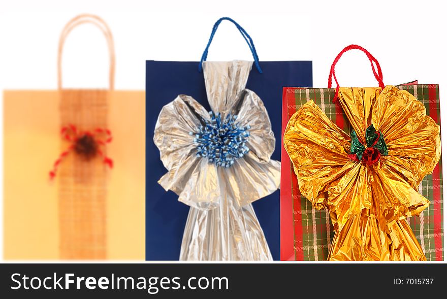Paper gift bags isolated on white back. Paper gift bags isolated on white back