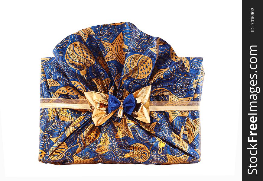 Paper wrapped xmas gift in golden and blue colors