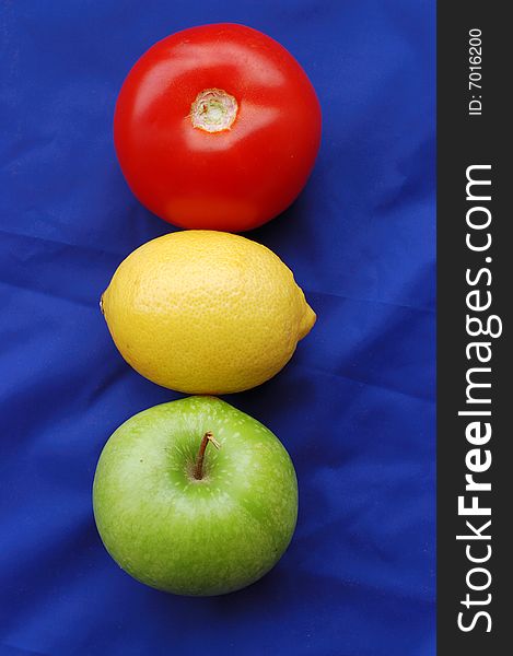 Concept of fruits representing traffic light on blue background. Concept of fruits representing traffic light on blue background
